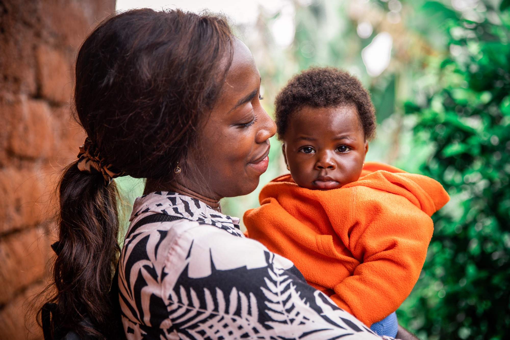 African mother holds her newborn daughter in her arms. Moment of passion and happiness
